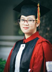 Portrait of a young woman in graduation attire, celebrating academic success.